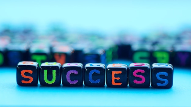 Photo close-up of success text on blocks