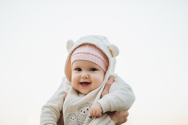 Close up of surprised babys face with lightly opened mouth