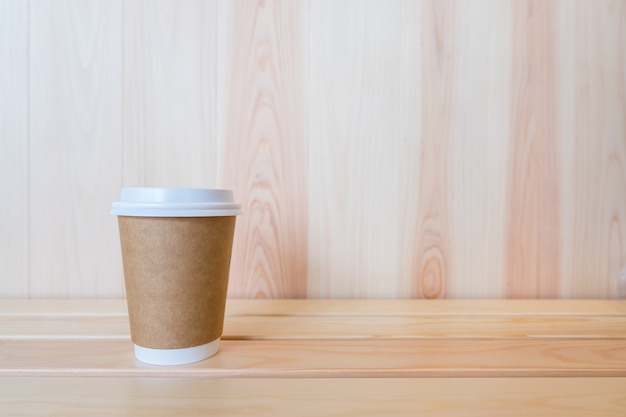 Close up of takeaway paper cup of hot coffee  