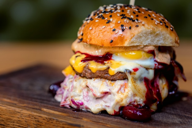 Close up tasty burger with minced meat served on tray