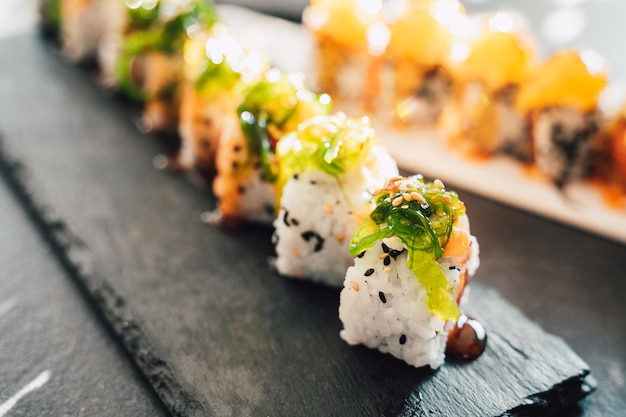 Close up of tasty japanese uramaki sushi with salmon