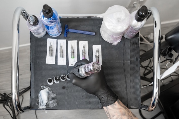 Close up of tattoo artist tools and workplace High quality photo