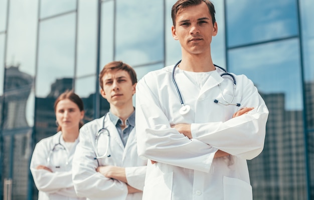 Close up. team of doctors standing on a city street