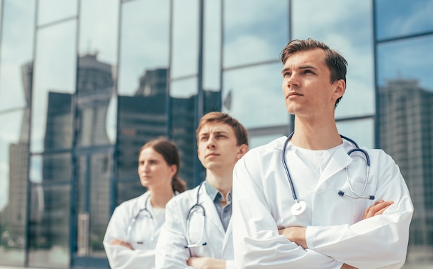 Close up. team of doctors standing on a city street.