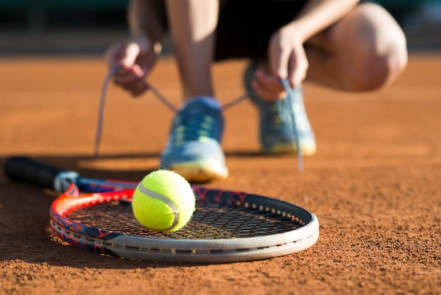 Close-up tennis ball on racket