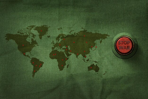 Photo close-up of text on button by world map