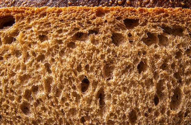 close up of the texture and coloration inside freshly baked sweet whole wheat bread