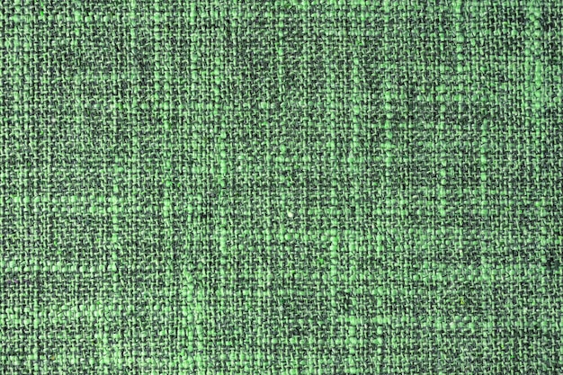 Close up texture of green coarse weave upholstery fabric Decorative textile background