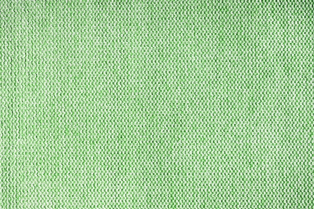 Close up texture of green coarse weave upholstery fabric Decorative textile background