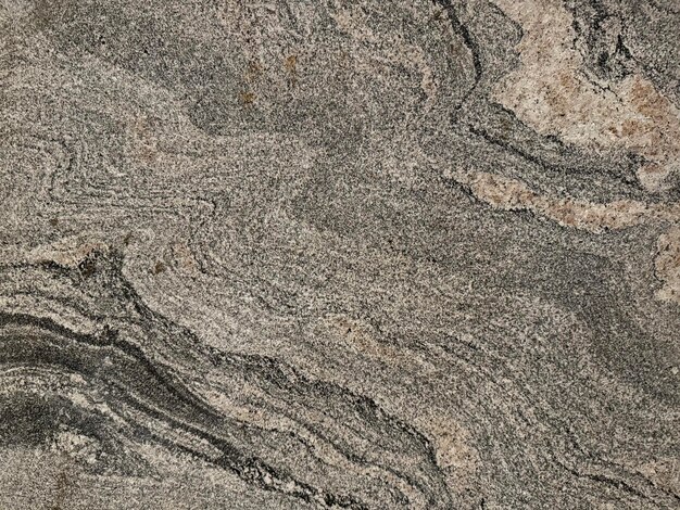 Close up texture of natural stone granite slab pattern in marble looking veining and grains Seamless