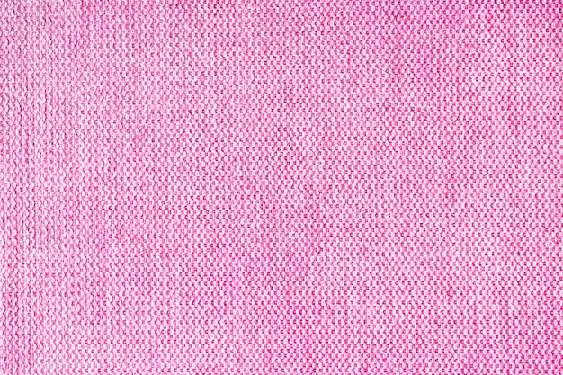 Close up texture of pink coarse weave upholstery fabric Decorative textile background