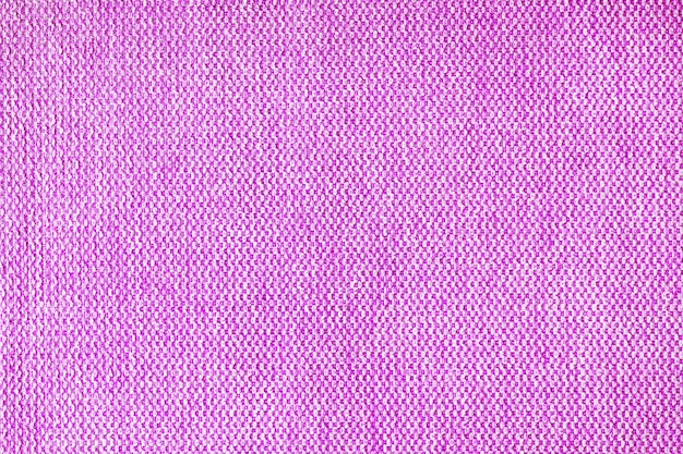 Close up texture of purple coarse weave upholstery fabric Decorative textile background