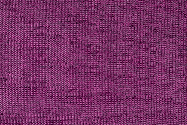 Close up texture of purple coarse weave upholstery fabric Decorative textile background