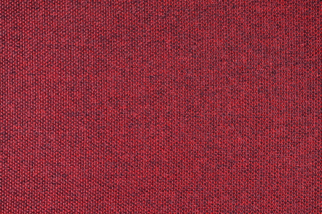 Close up texture of red coarse weave upholstery fabric Decorative textile background