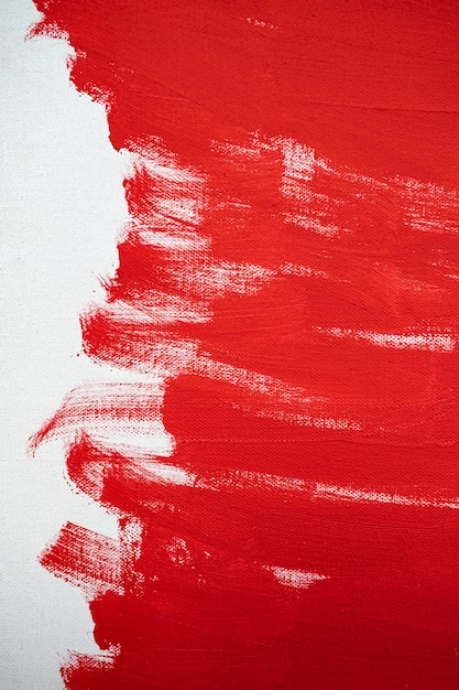 Close up Texture Red color paint on white colour canvas Brush marks stroke for paper graphic design on background