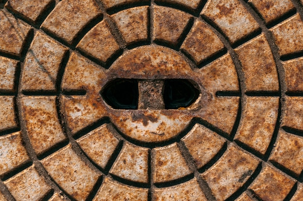 Close up, texture of rusty metal hatch.