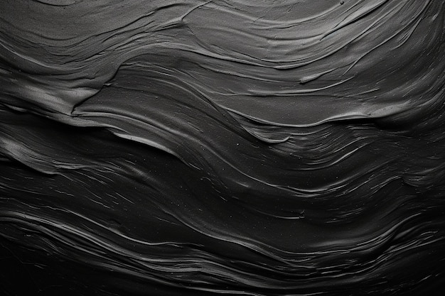 Close up of textured black paint strokes on canvas