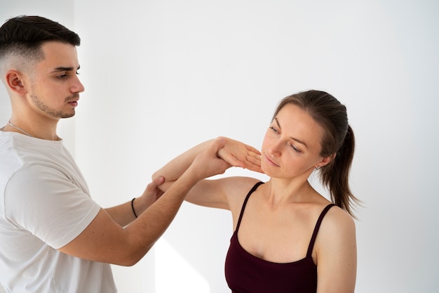 Close up therapist helping patient recover