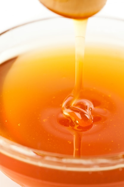 Close up of a thin honey trickle