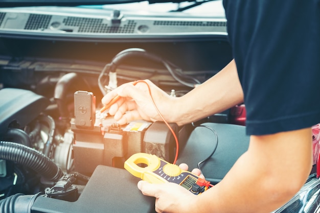 Close up tool and men hand of mechanic car repair during investigate cause of problem