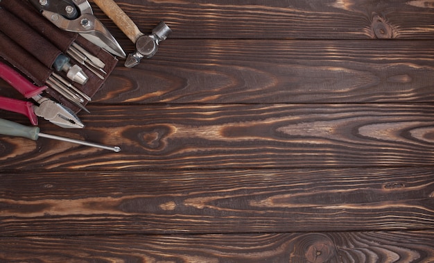 Close up tools on a wooden background