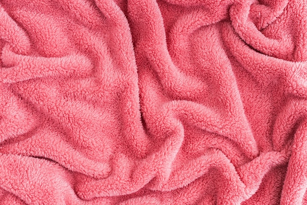 Close up top view of coral blanket wrinkled texture. Fluffy coral background.