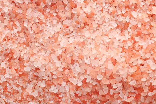 Close up top view of himalayan pink salt texture background with high resolution.