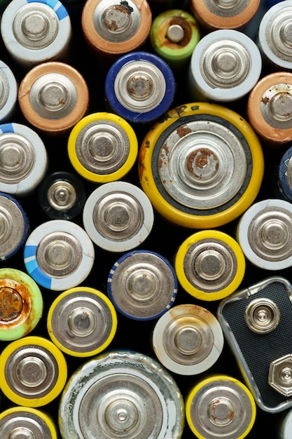 Close up top view of used battery electronic hazardous waste concept batteries background