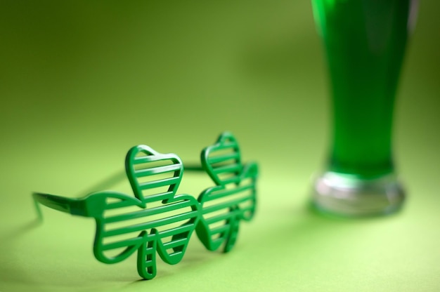 Close-up of toy with drink on green background