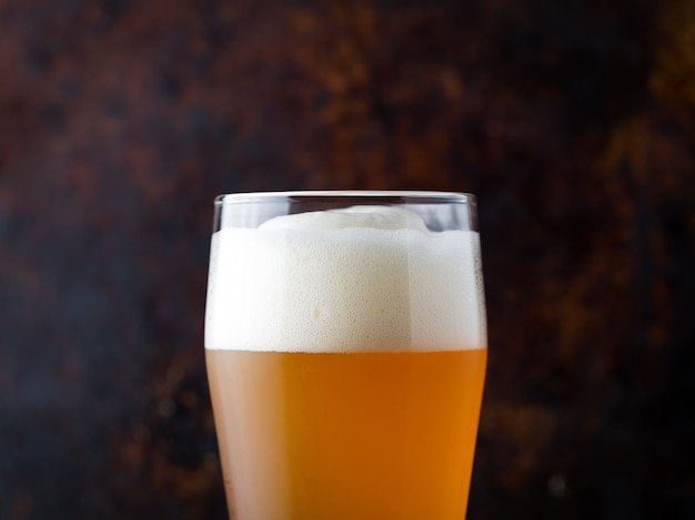 Close - up of traditional full glass of unfiltered wheat beer