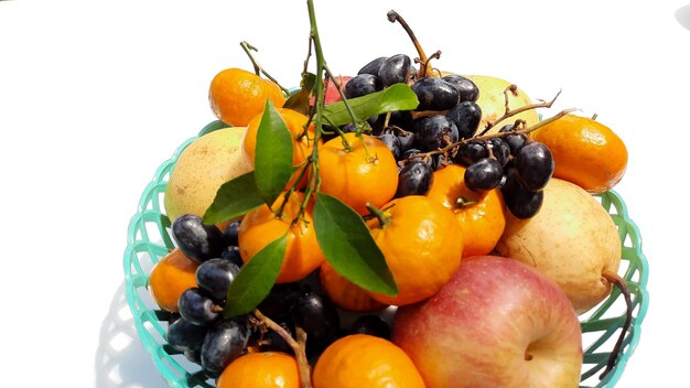 Close up, Tropical fruit in green basket on white background 04