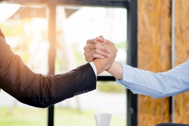 Close-up of two business people Greeting Deal at work