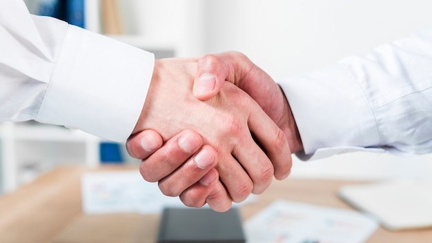 Close-up of two businessman shaking hands