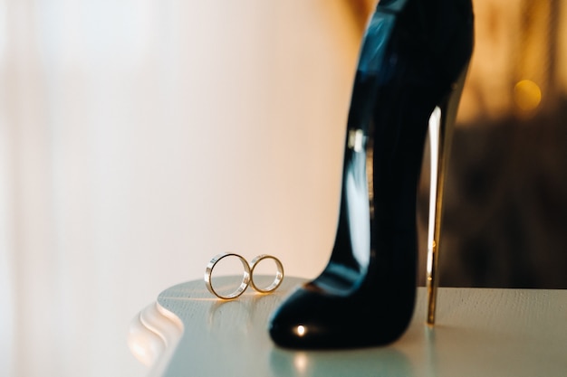 Close-up of two gold wedding rings for a wedding.