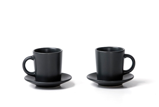 Close-up of two identical coffee tea cups with a saucer on a white background