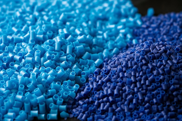 Photo close up of a two stacks of blue plastic polypropylene granules on a tablegenerative ai