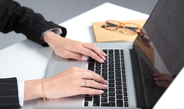 Close-up of typing female hands on keyboard