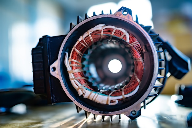 Close-up of an unidentified part with a thick bundle of copper wire for the production of air transport in the production of military equipment. The concept of modern military technology