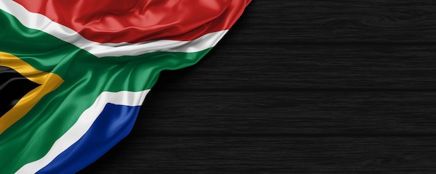 Close up of united states of South Africa flag on the black wooden background 3d render