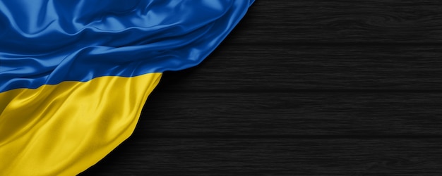 Close up of united states of Ukraine flag on the black wooden background 3d render