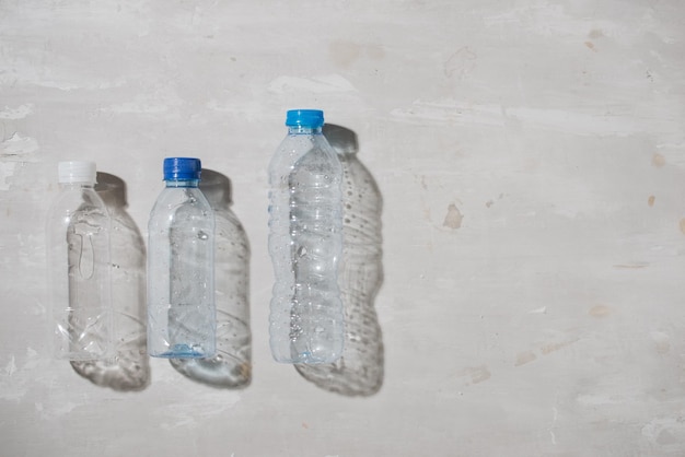 Close up of used plastic bottles on white background