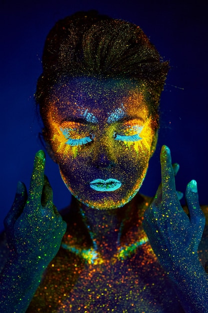 Close up uv portrait glowing in a dark