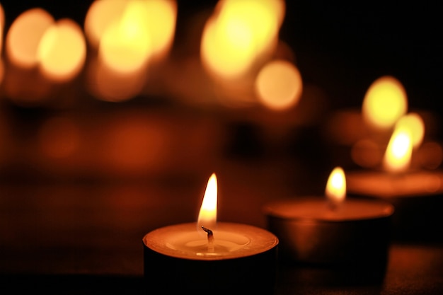 Close up view of the candles cutting through the darkness.