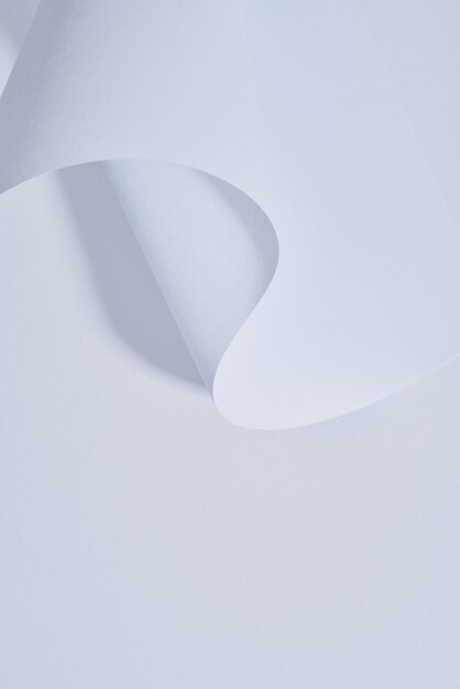 Close up view of curved paper sheet on white background