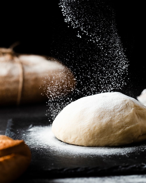 Close-up view of dough on black background