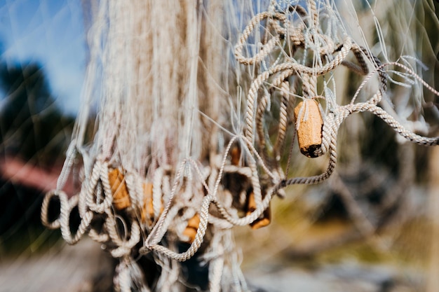 Close up view of fishing net. Marine background.