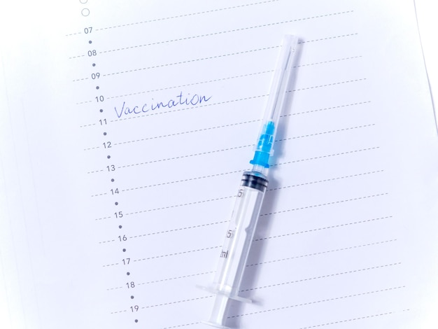 Close up view photo of word vaccination written in daily planner