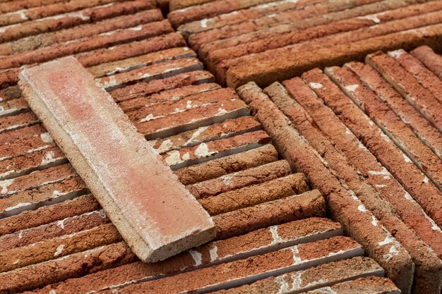 Close up view of a pile of traditional mud brick production.