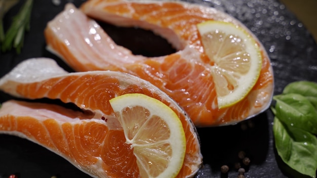 Close up view of seasoning process of salmons fillet