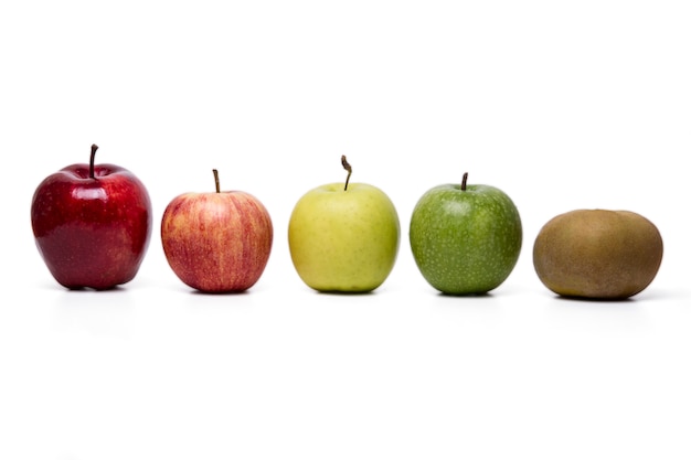 Close up view of several apples of different cultivars,  isolated on a white background.